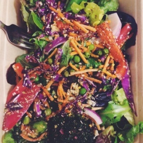 Rainbow salad in a cardboard container