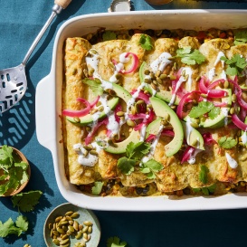 enchiladas in a pan from the Ambitious Kitchen Cookbook