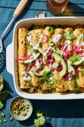 enchiladas in a pan from the Ambitious Kitchen Cookbook