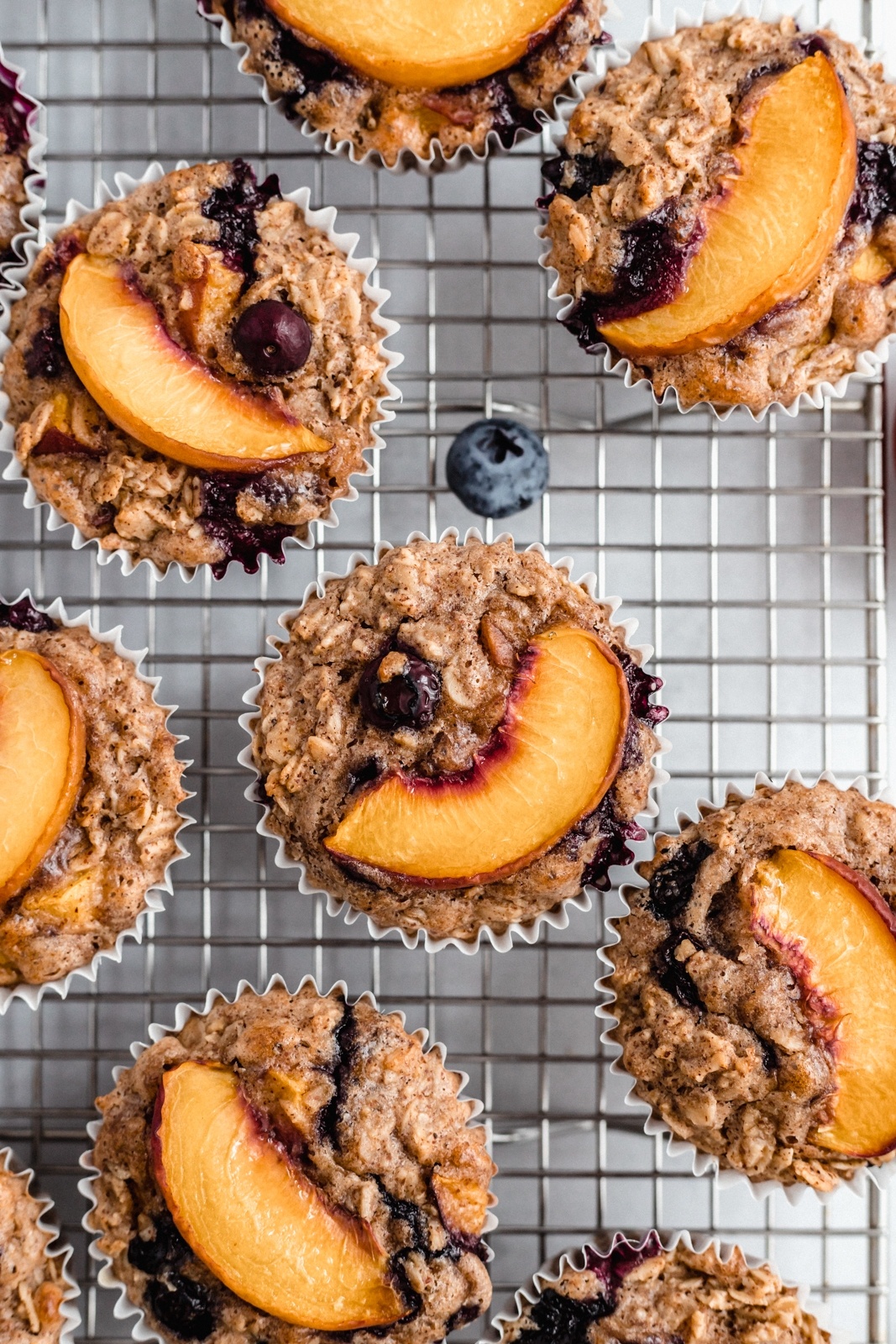 gluten free peach oatmeal cups on a wire rack