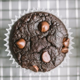 black bean muffin with chocolate chips on a wire rack