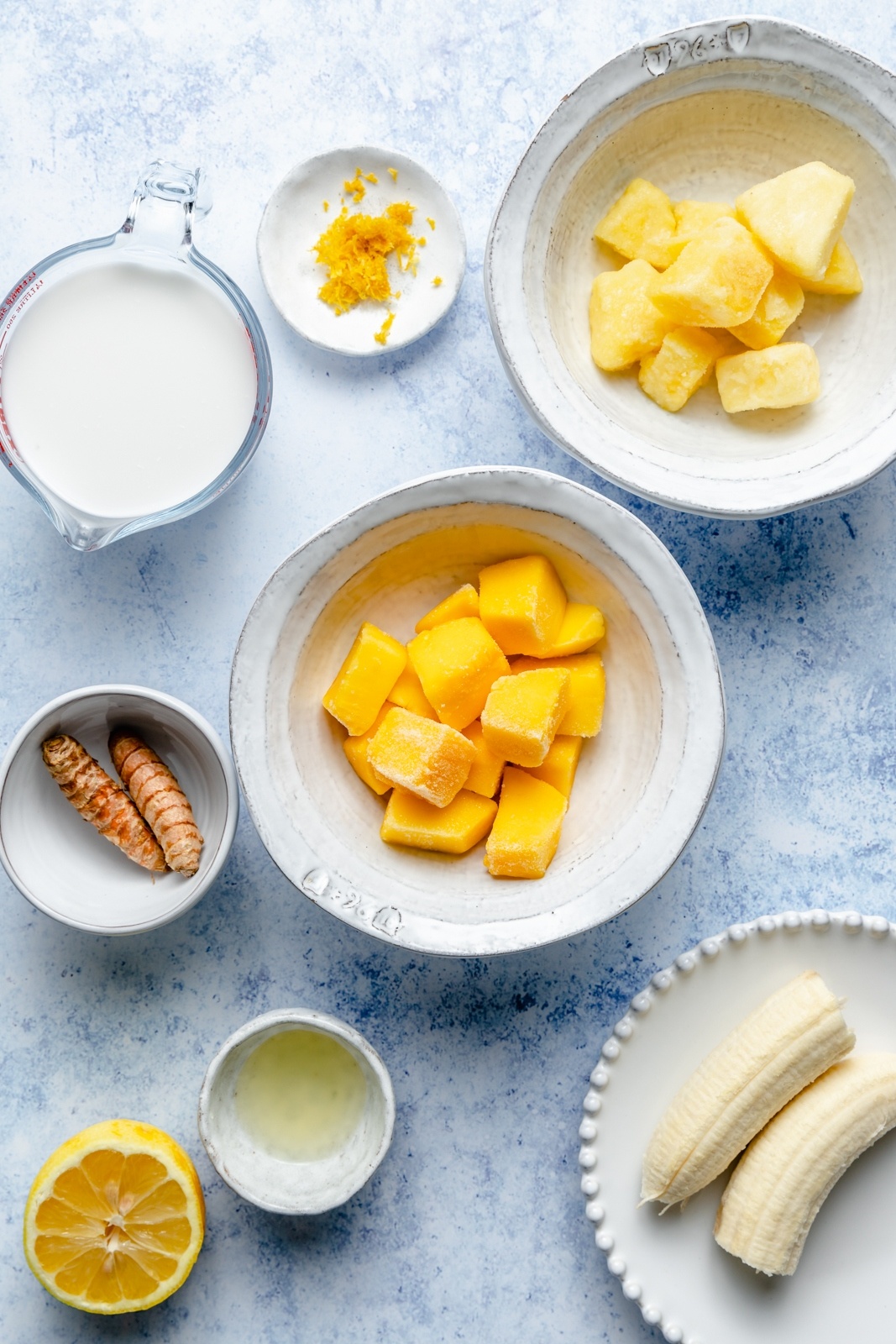 ingredients for a turmeric smoothie in bowls