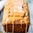 drizzling healthy chai banana bread with vanilla glaze