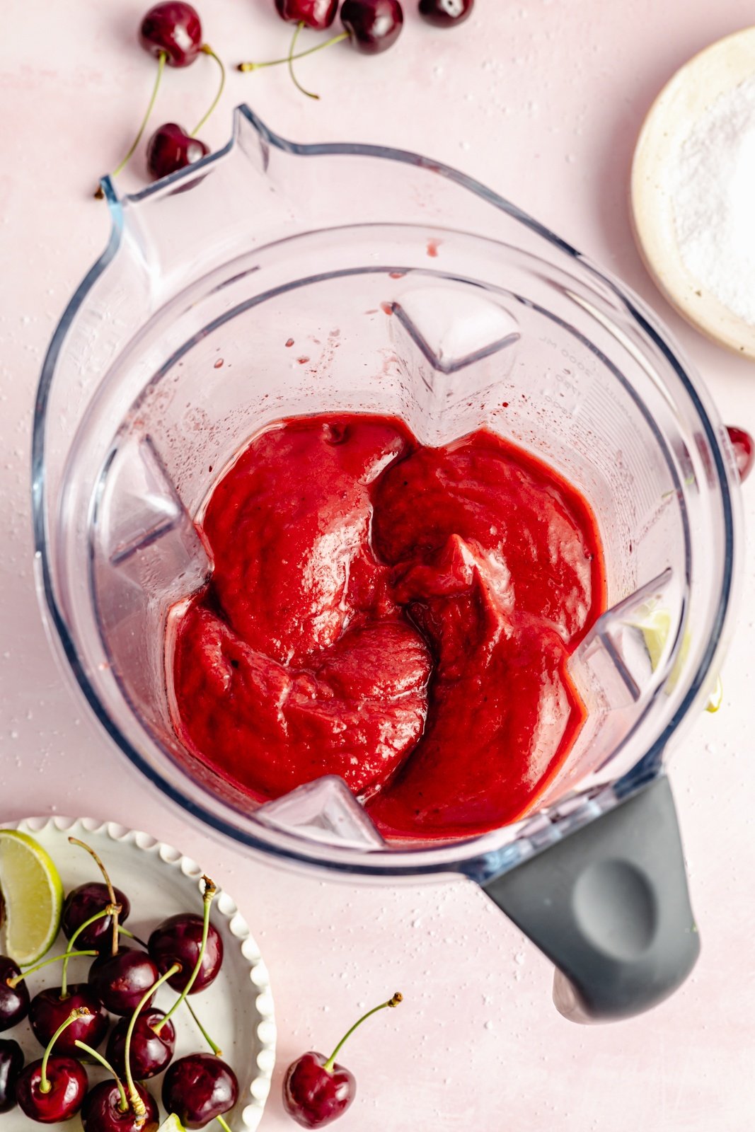 frozen cherry lime margarita in a blender