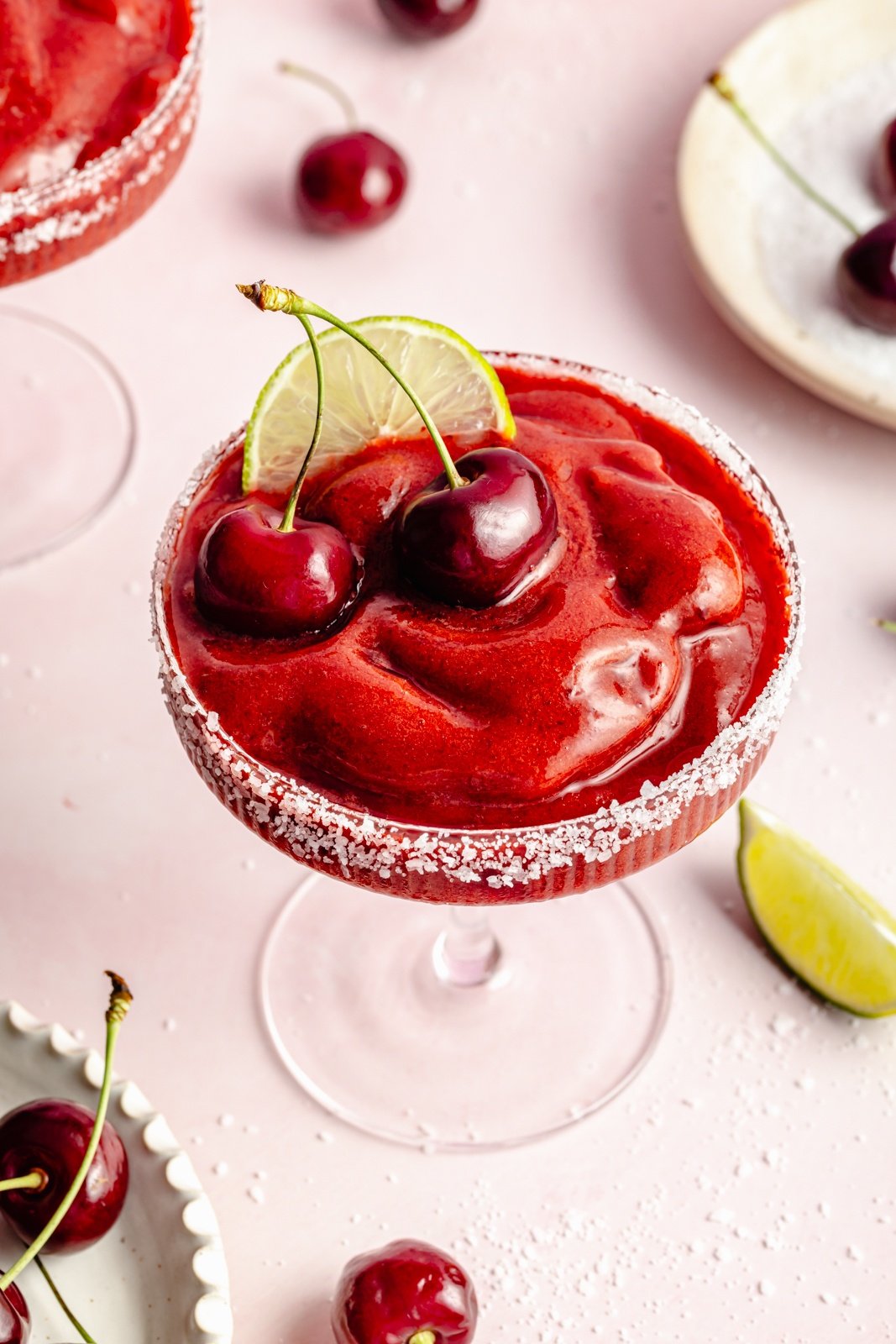 top-down view of a frozen cherry margarita in a cocktail glass