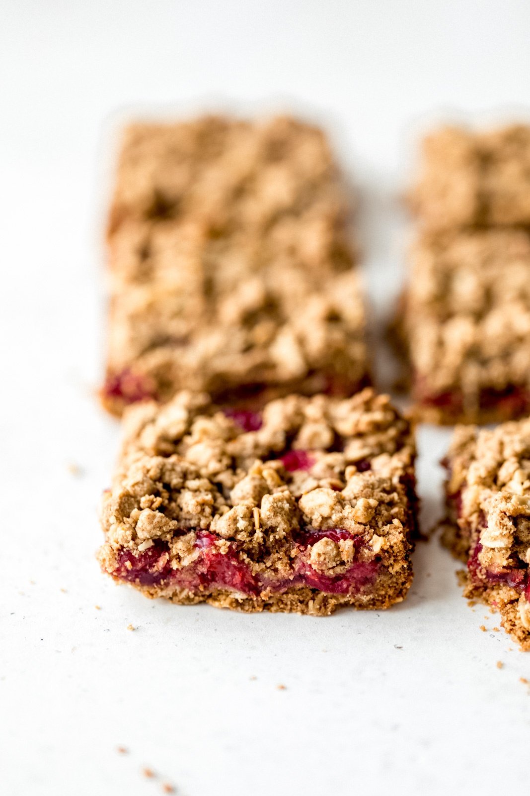 tart cherry pie bars cut into squares on a white board