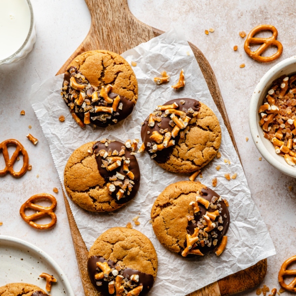 chocolate-dipped peanut butter cookies on a board