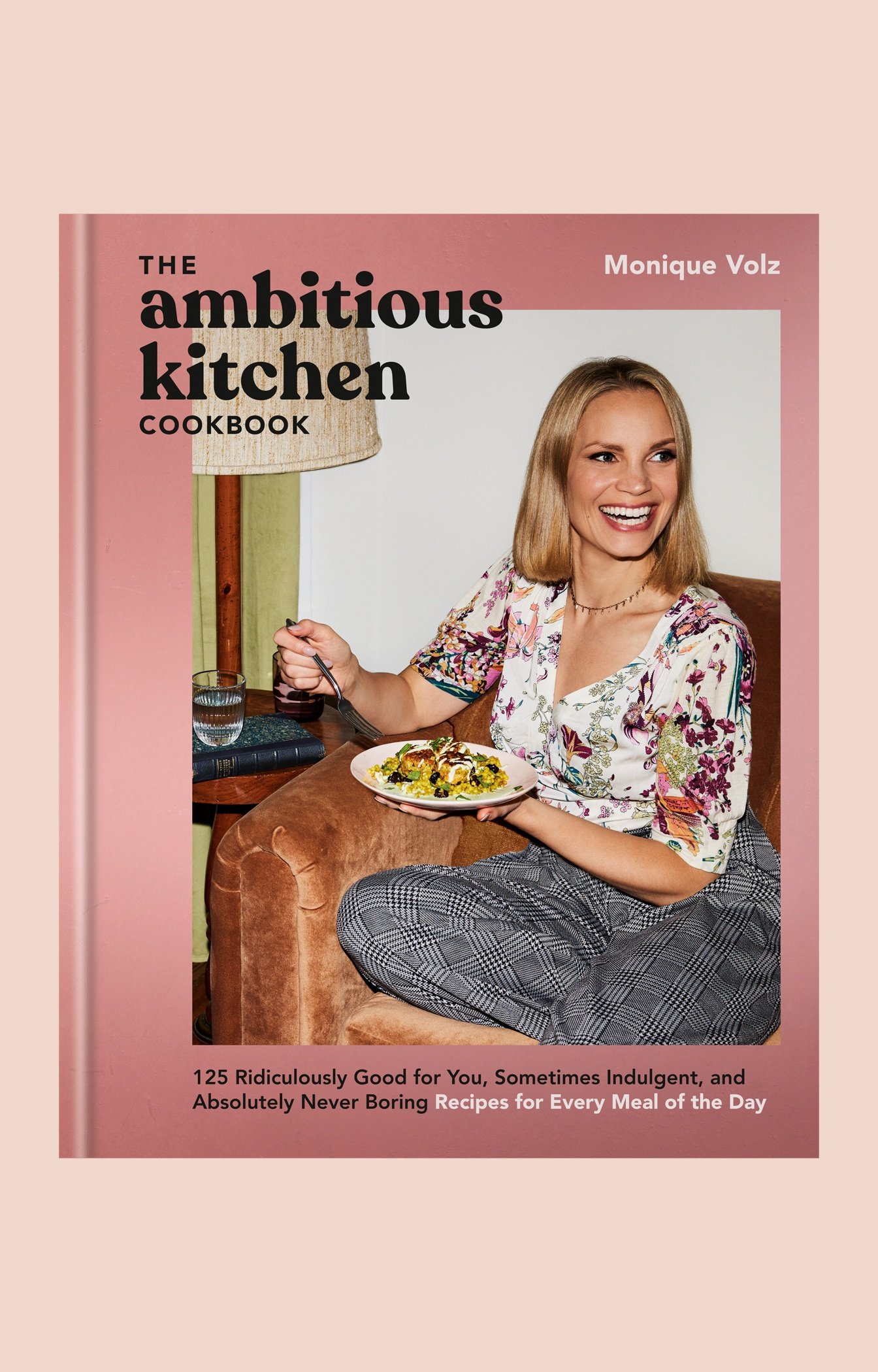 cover of the ambitious kitchen cookbook on a pink background