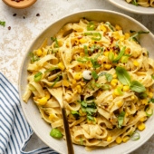 brown butter corn pasta in a bowl with a fork