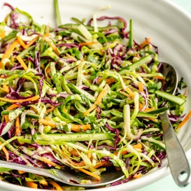 cucumber jalapeño cabbage slaw in a mixing bowl