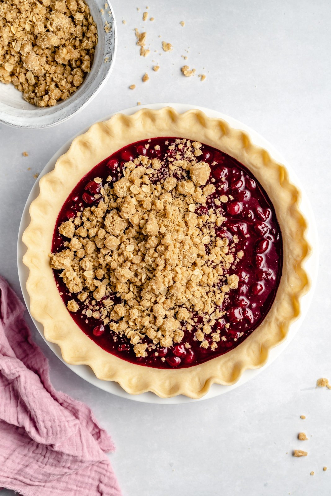 unbaked tart cherry pie with homemade pie crust in a pan