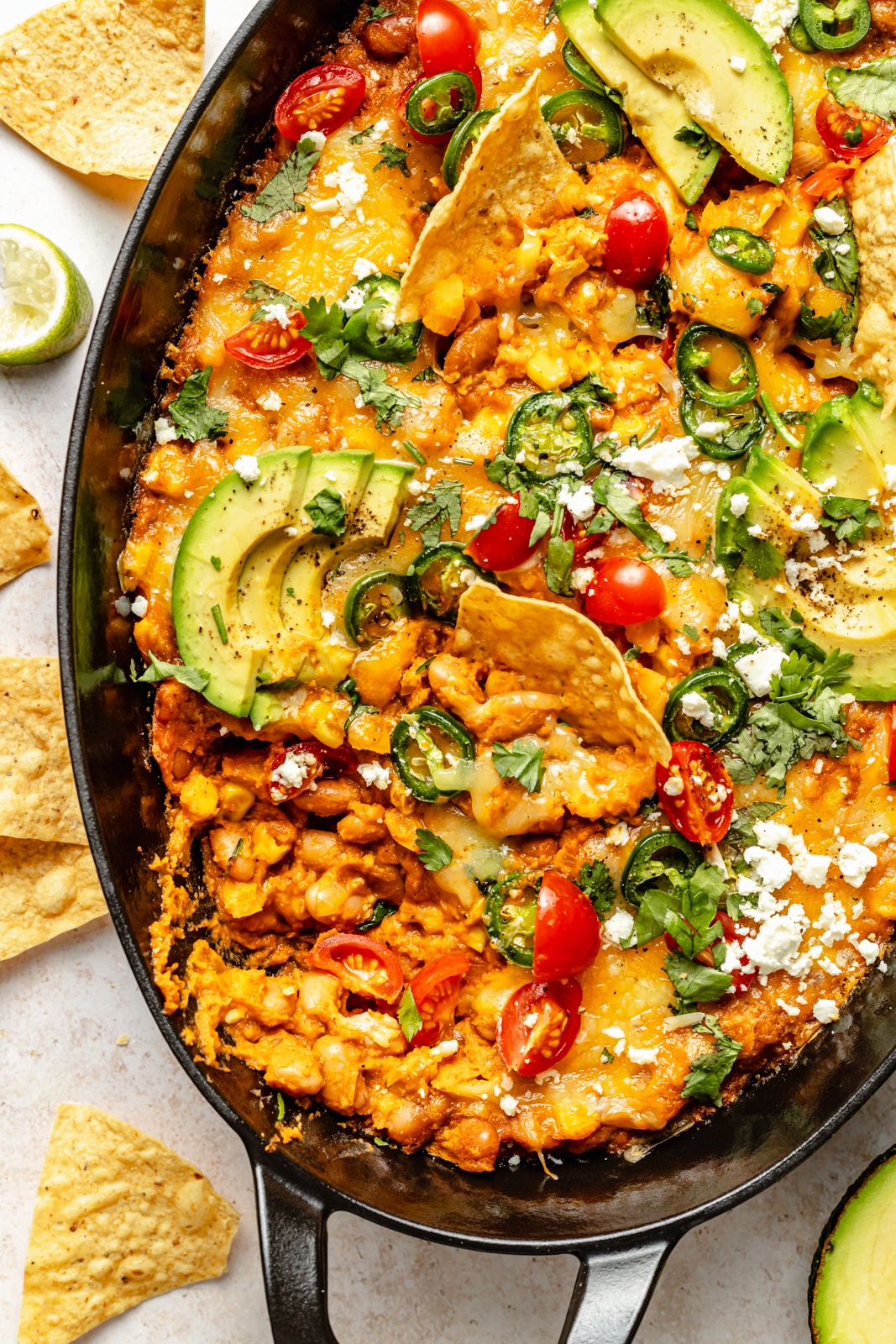 high-protein southwest bean dip in a skillet with tortilla chips