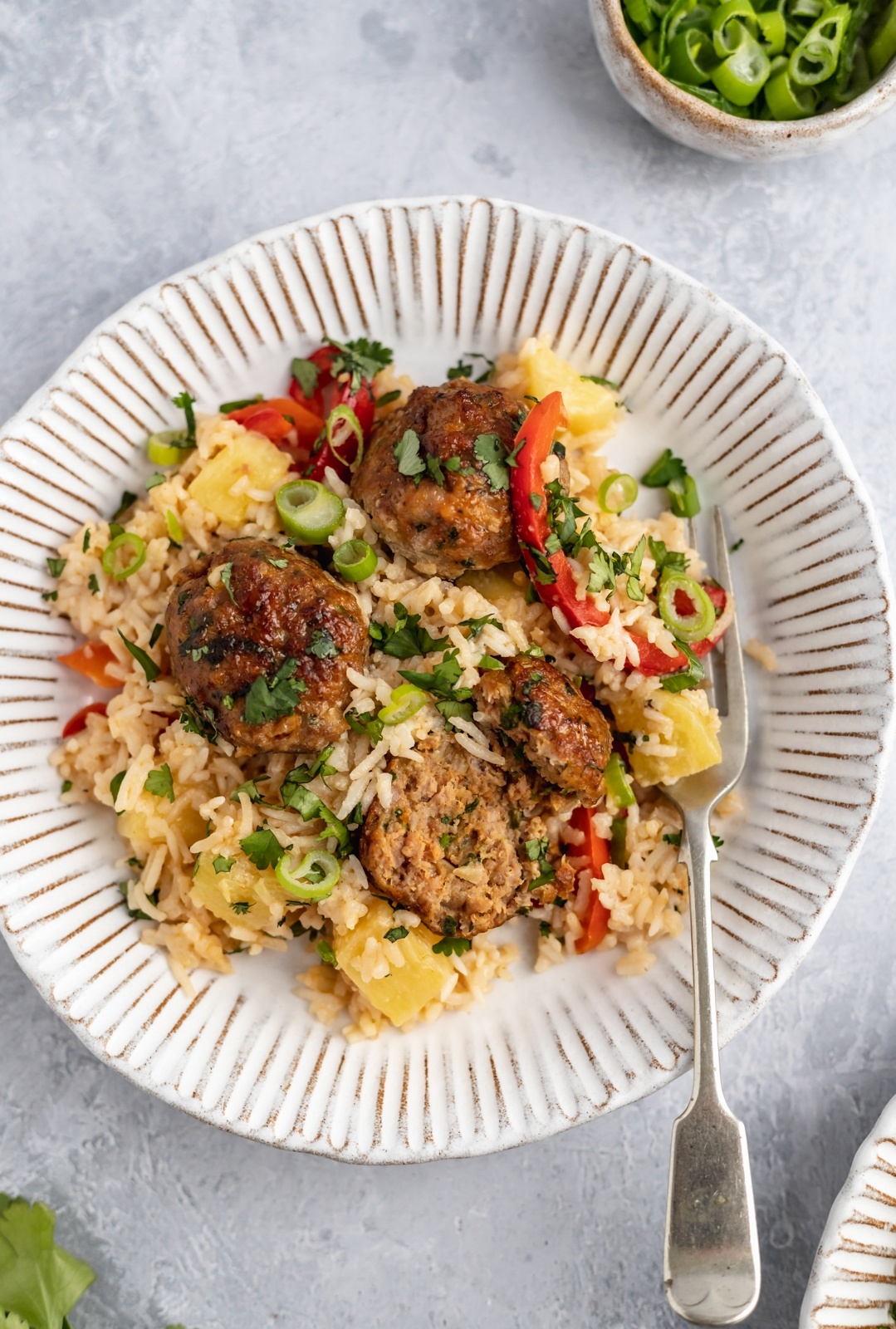 gluten free firecracker chicken meatballs on a plate with rice