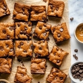 almond butter blondies on parchment paper