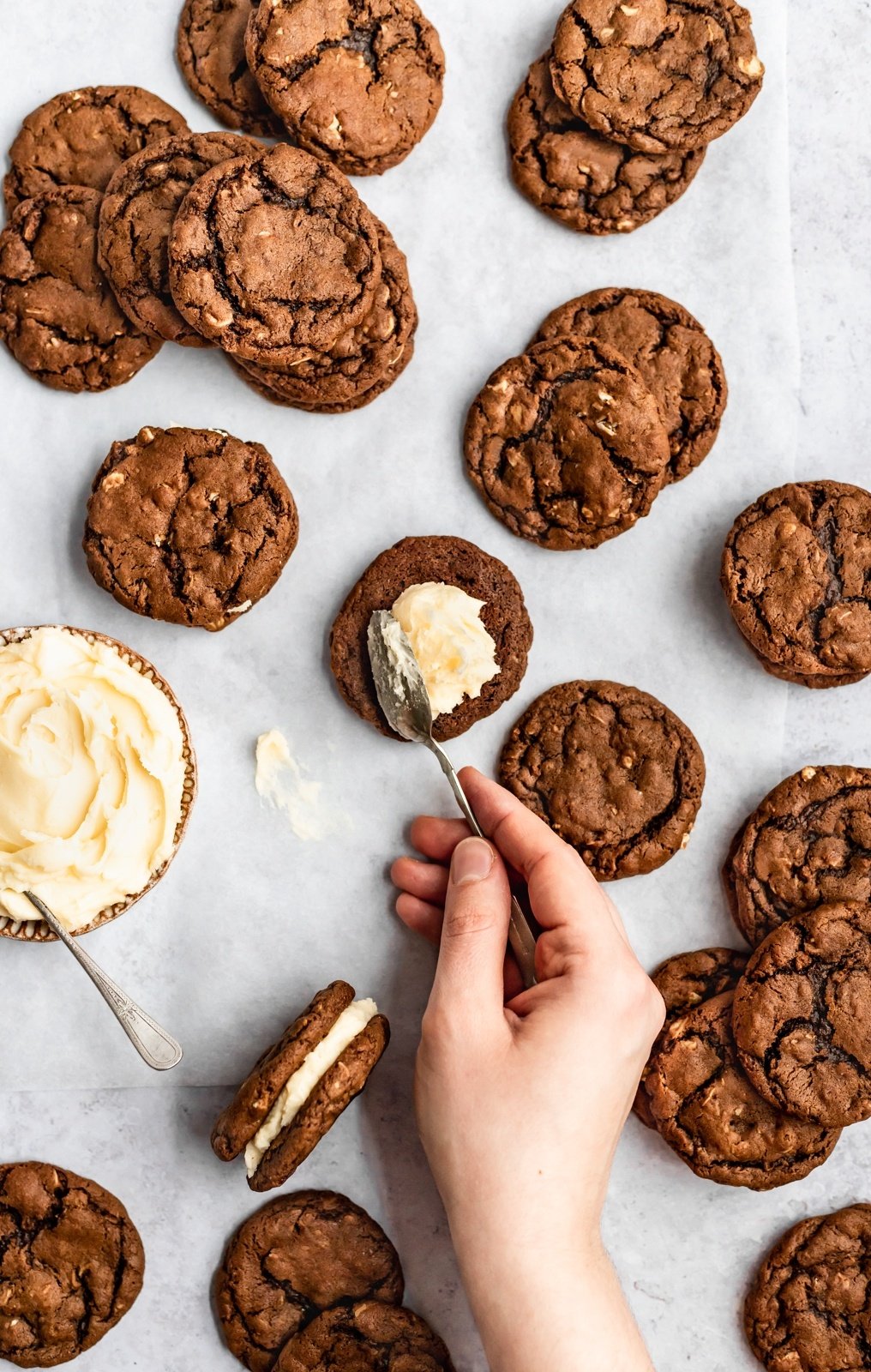 making gingerbread oatmeal cookie sandwiches on parchment paper