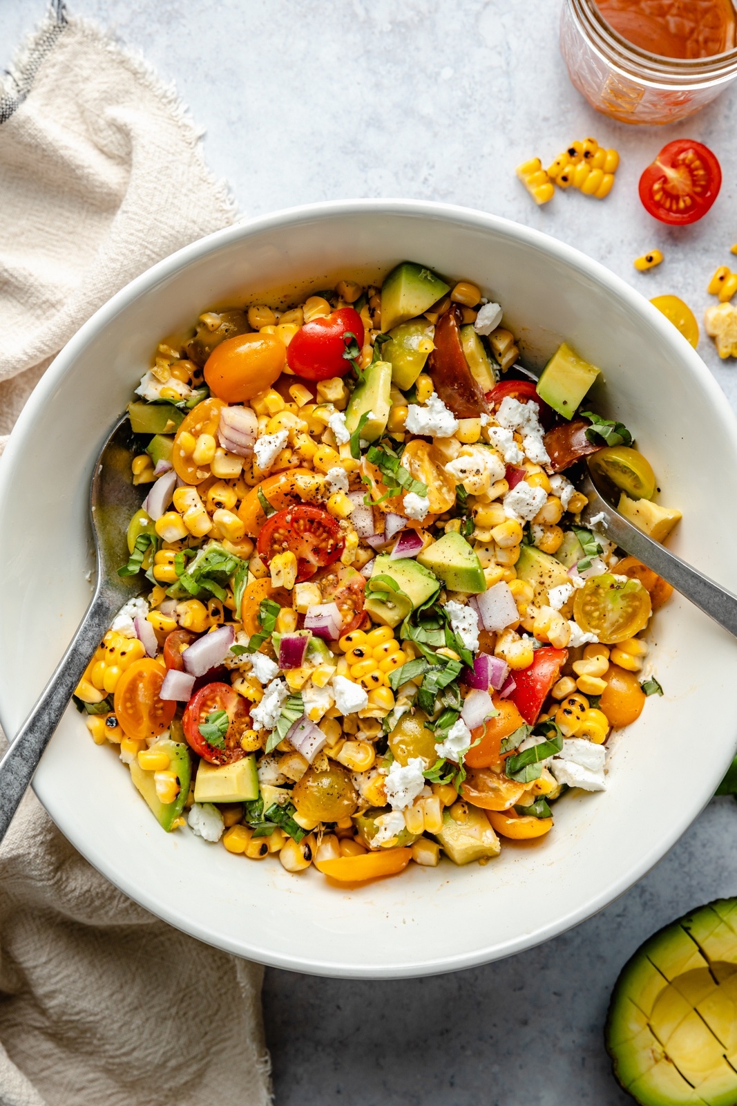 spicy grilled corn salad in a bowl with tongs