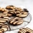 fudge striped cookies on a wire rack