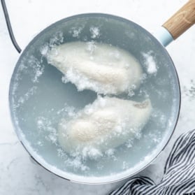 poaching chicken breasts in a pot