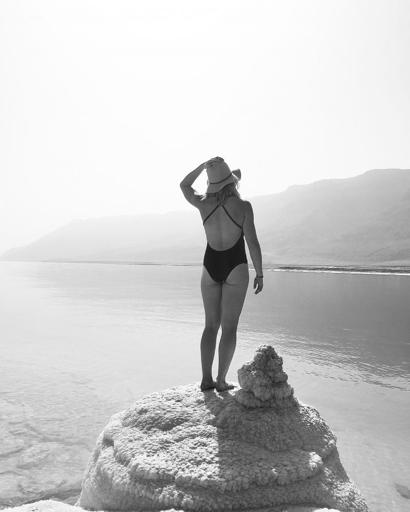 monique standing on a rock overlooking the sea