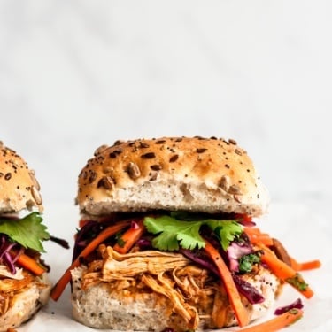 slow cooker pulled chicken sandwich with slaw on top