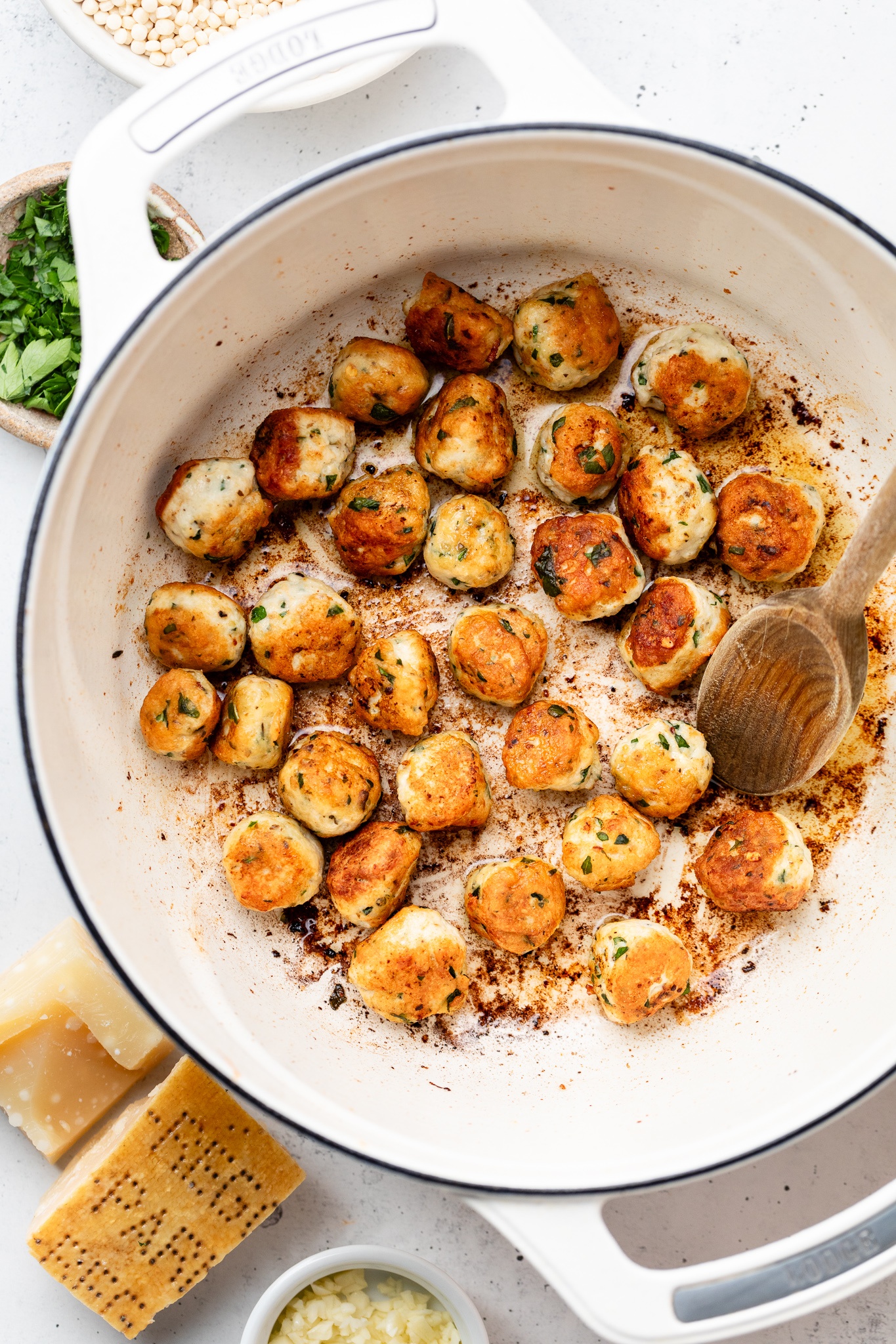 cooking chicken meatballs for Italian wedding soup in a pot