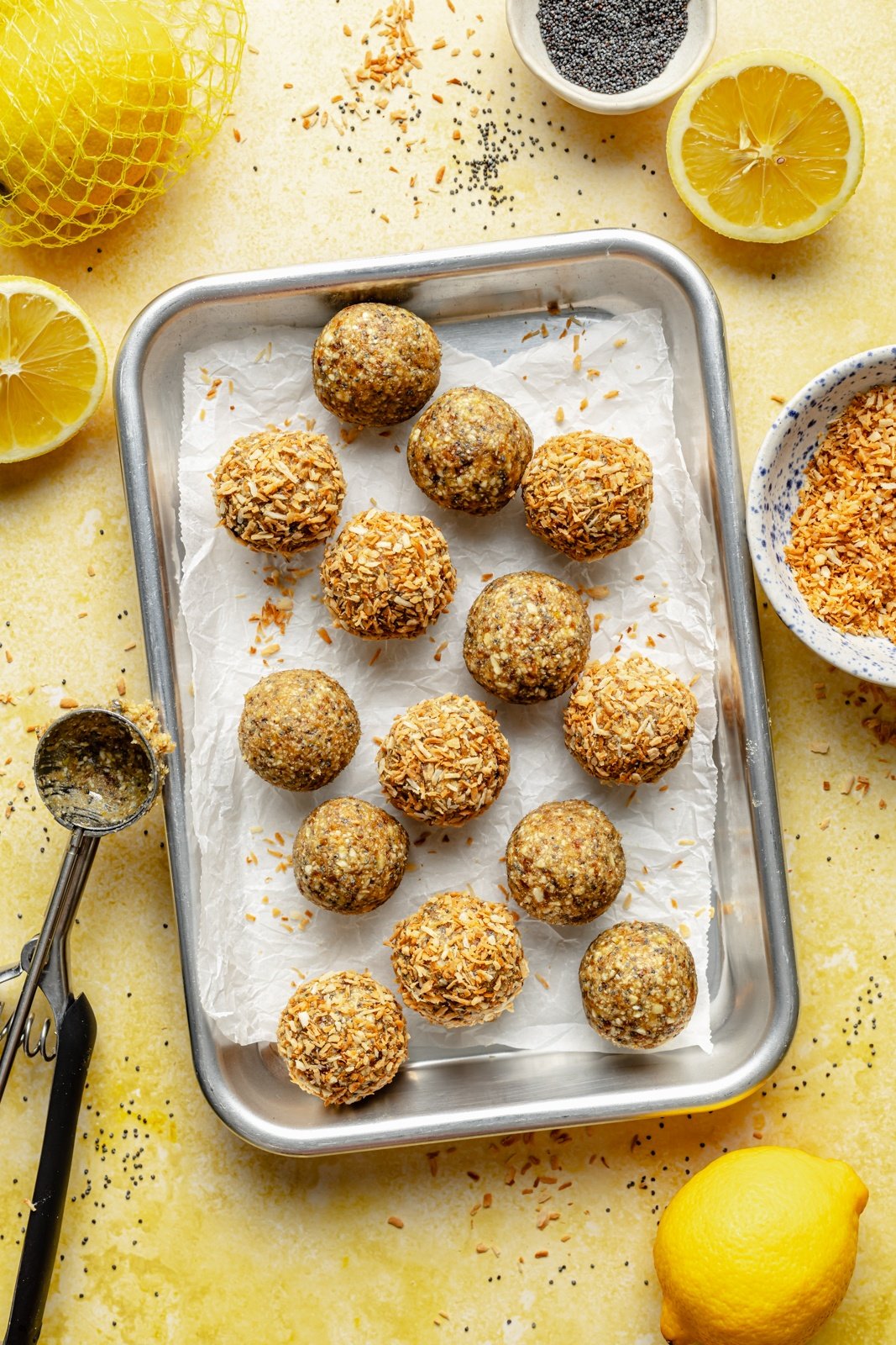 lemon energy bites on a baking sheet