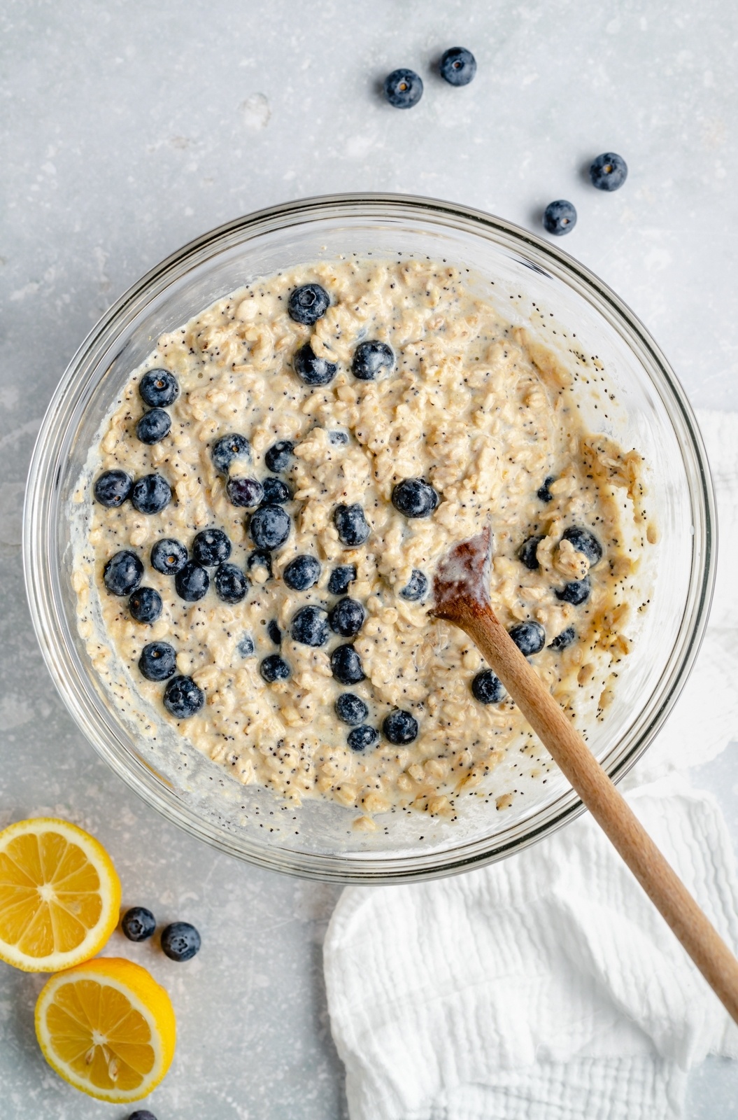 lemon baked oatmeal batter with blueberries in a mixing bowl