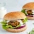 moroccan-inspired turkey burger topped with feta sauce, lettuce and red onion