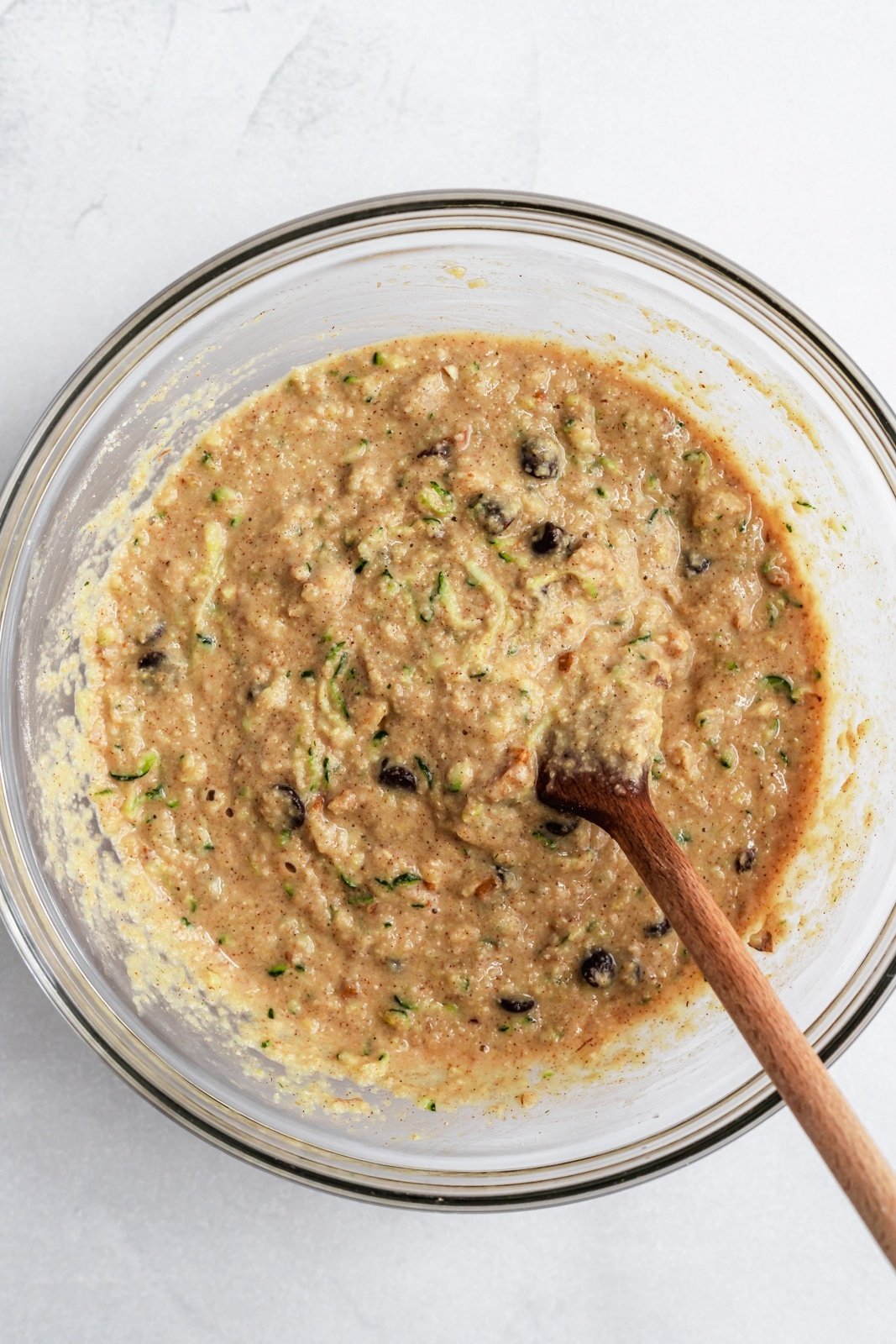 batter for gluten free zucchini muffins in a bowl