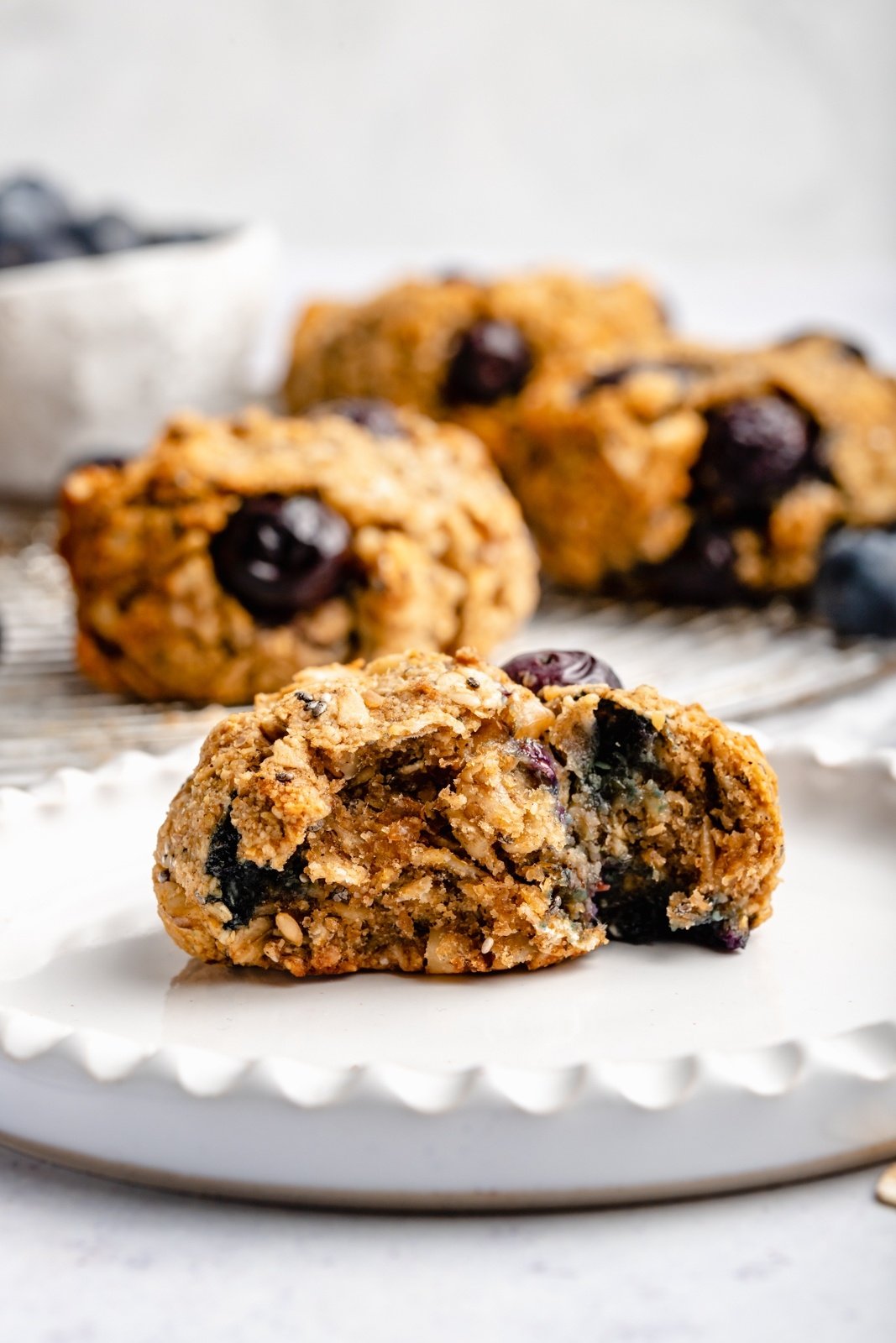 blueberry breakfast cookie on a plate with a bite taken out