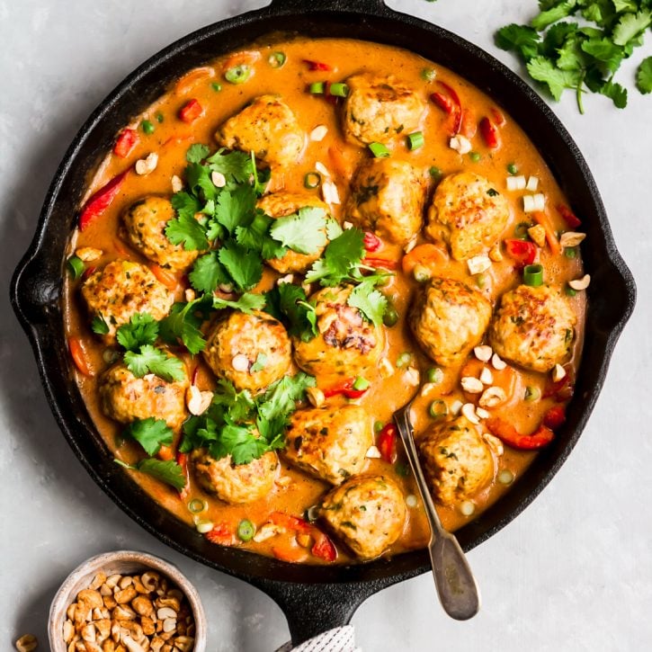 ginger chicken meatballs in a cast iron skillet