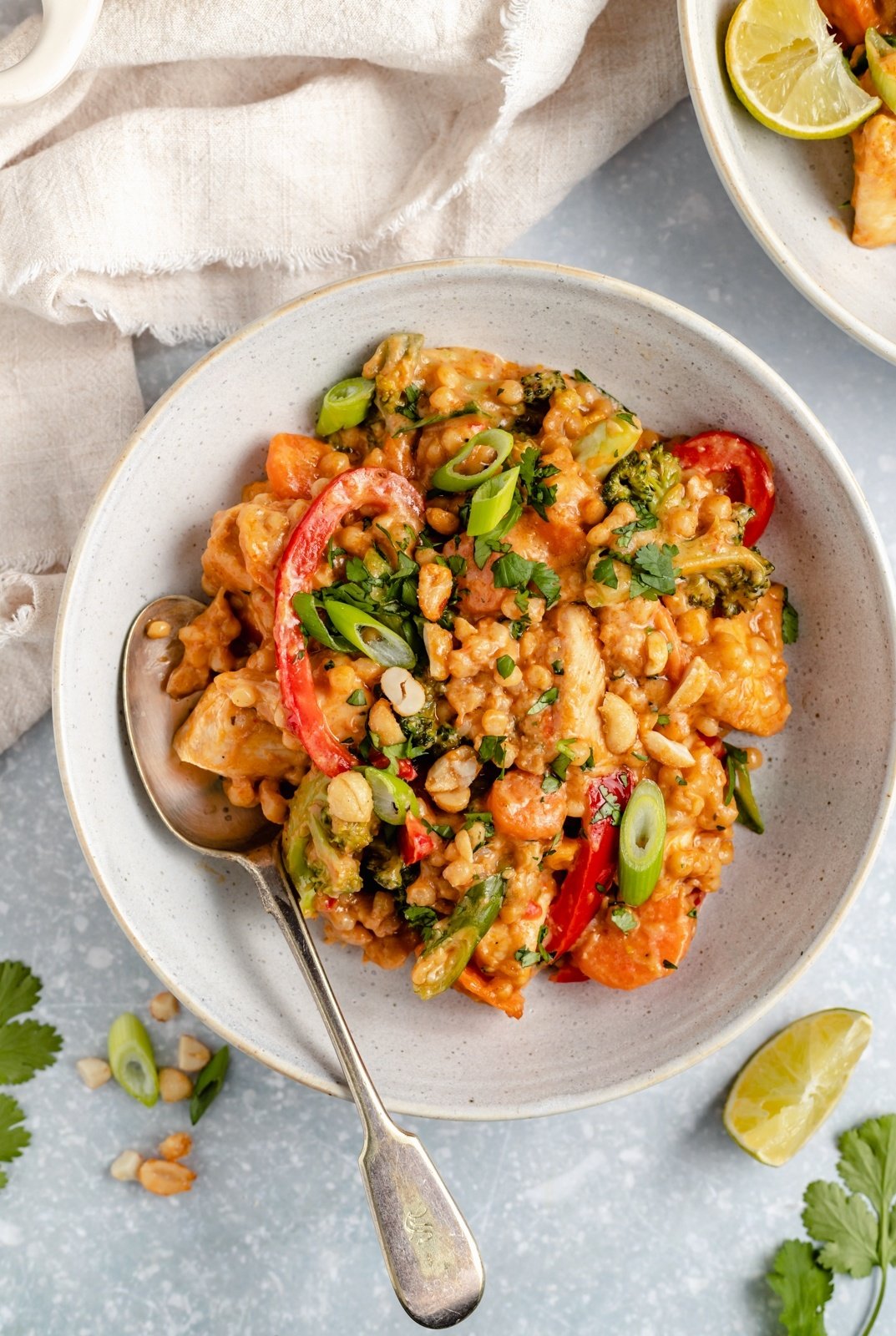 Thai chicken couscous in a bowl with a spoon