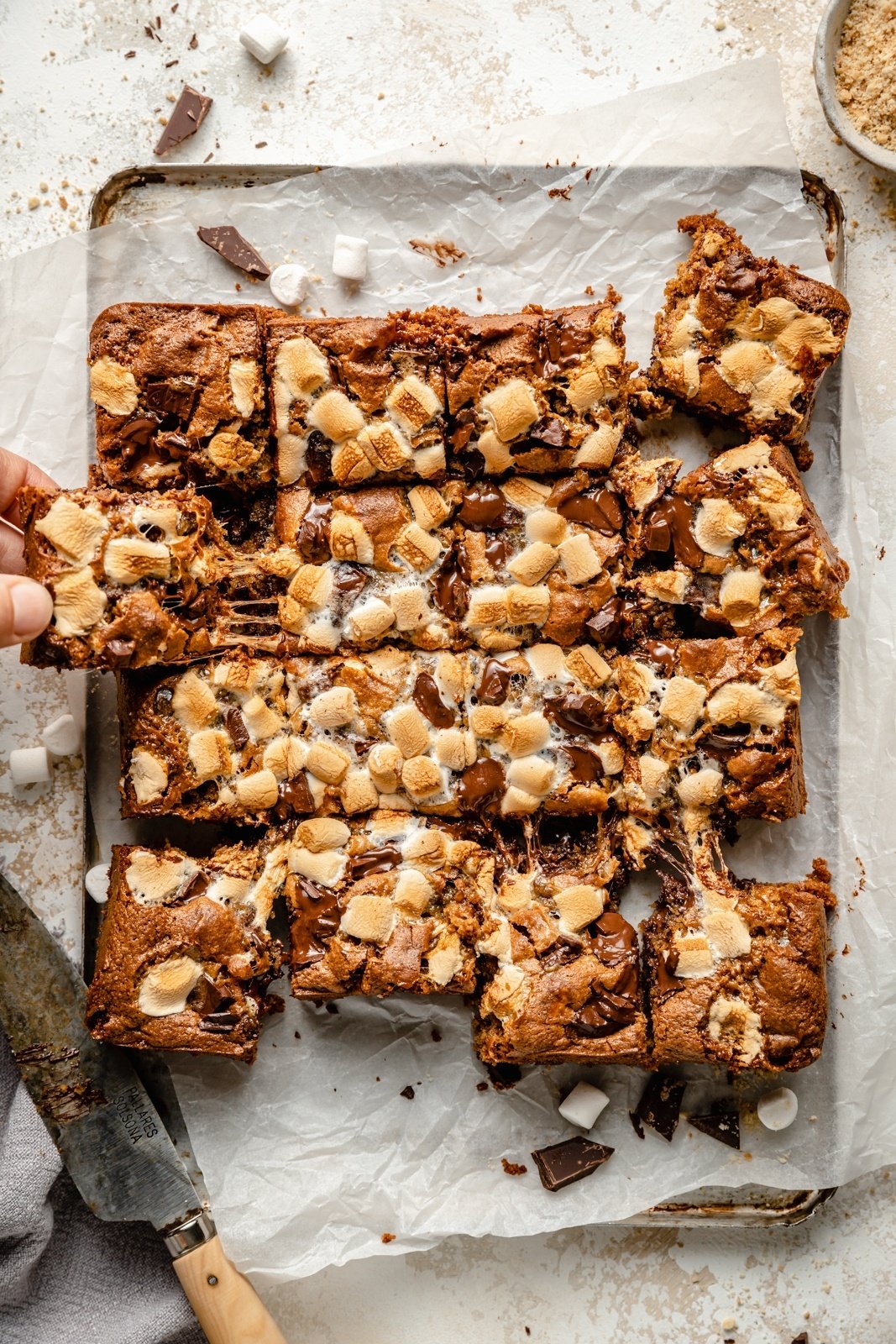 tahini s'mores bars sliced on parchment paper