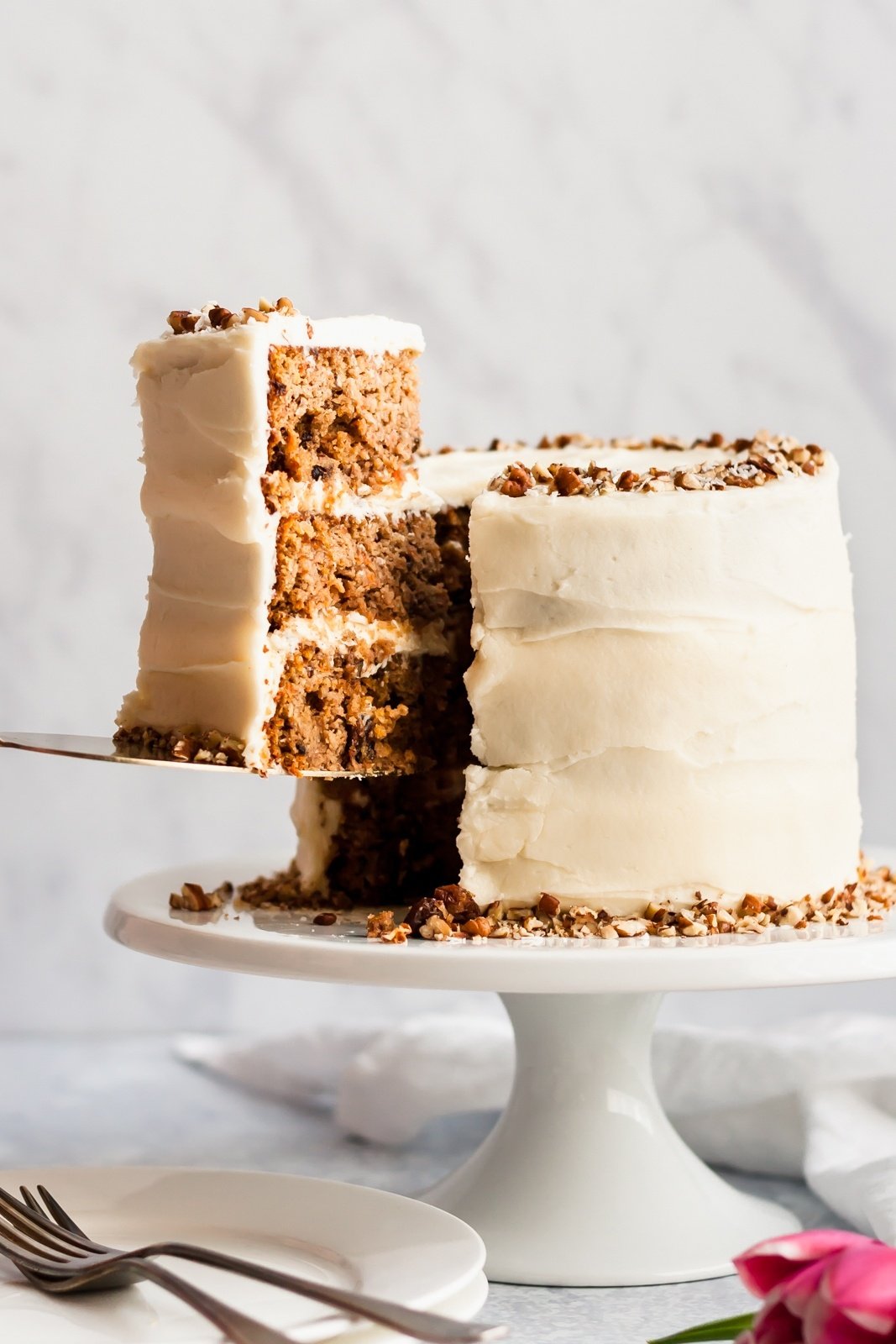 gluten free carrot cake on a cake stand