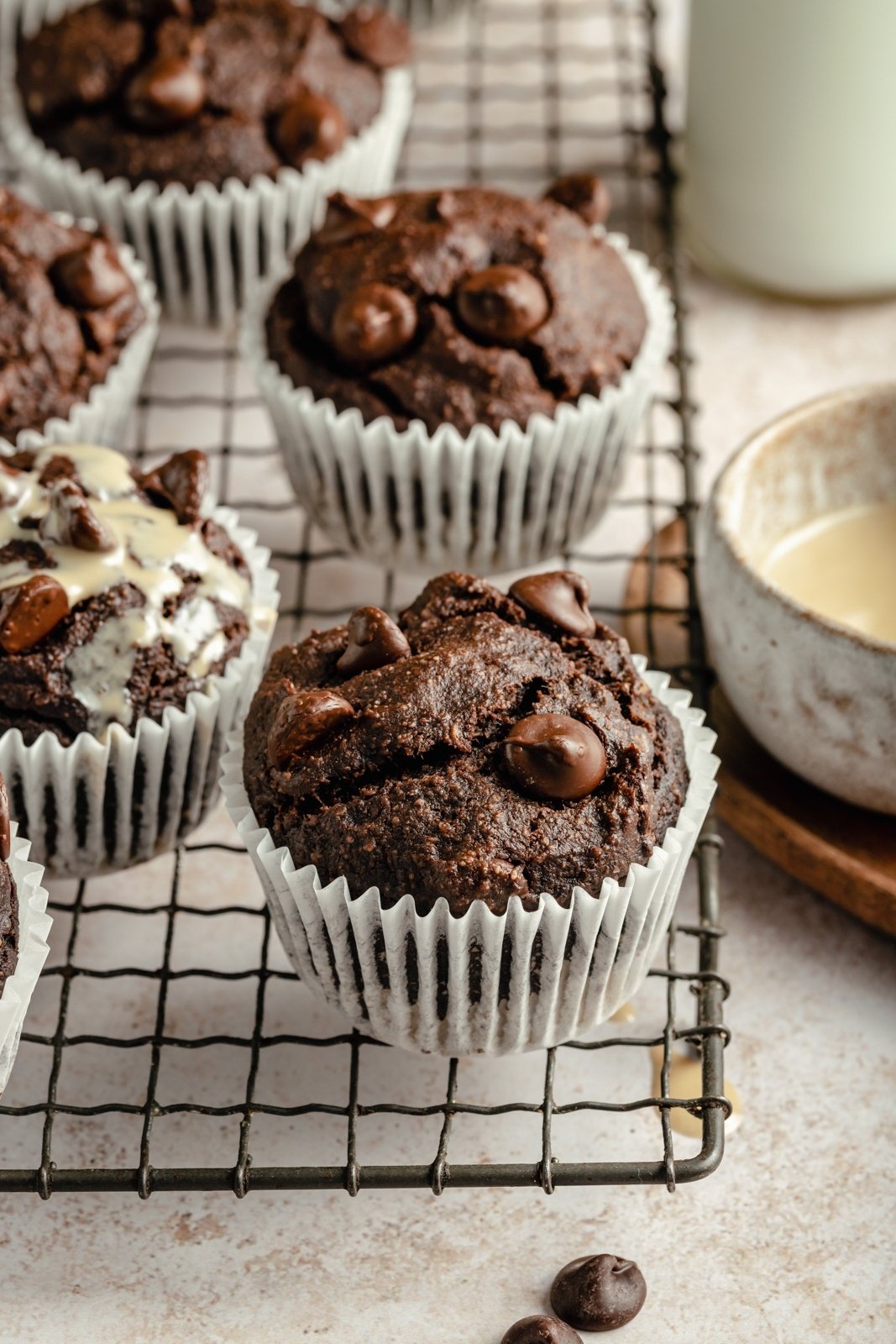 chocolate tahini banana muffins on a wire rack