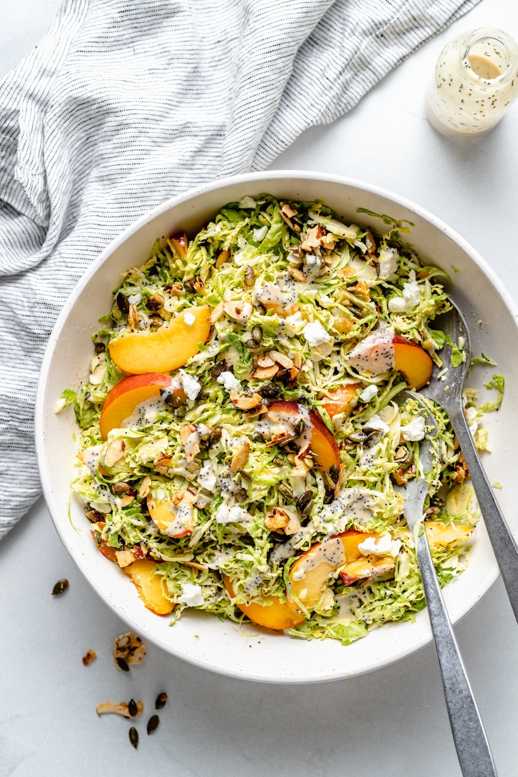 peach brussels sprouts salad in a bowl