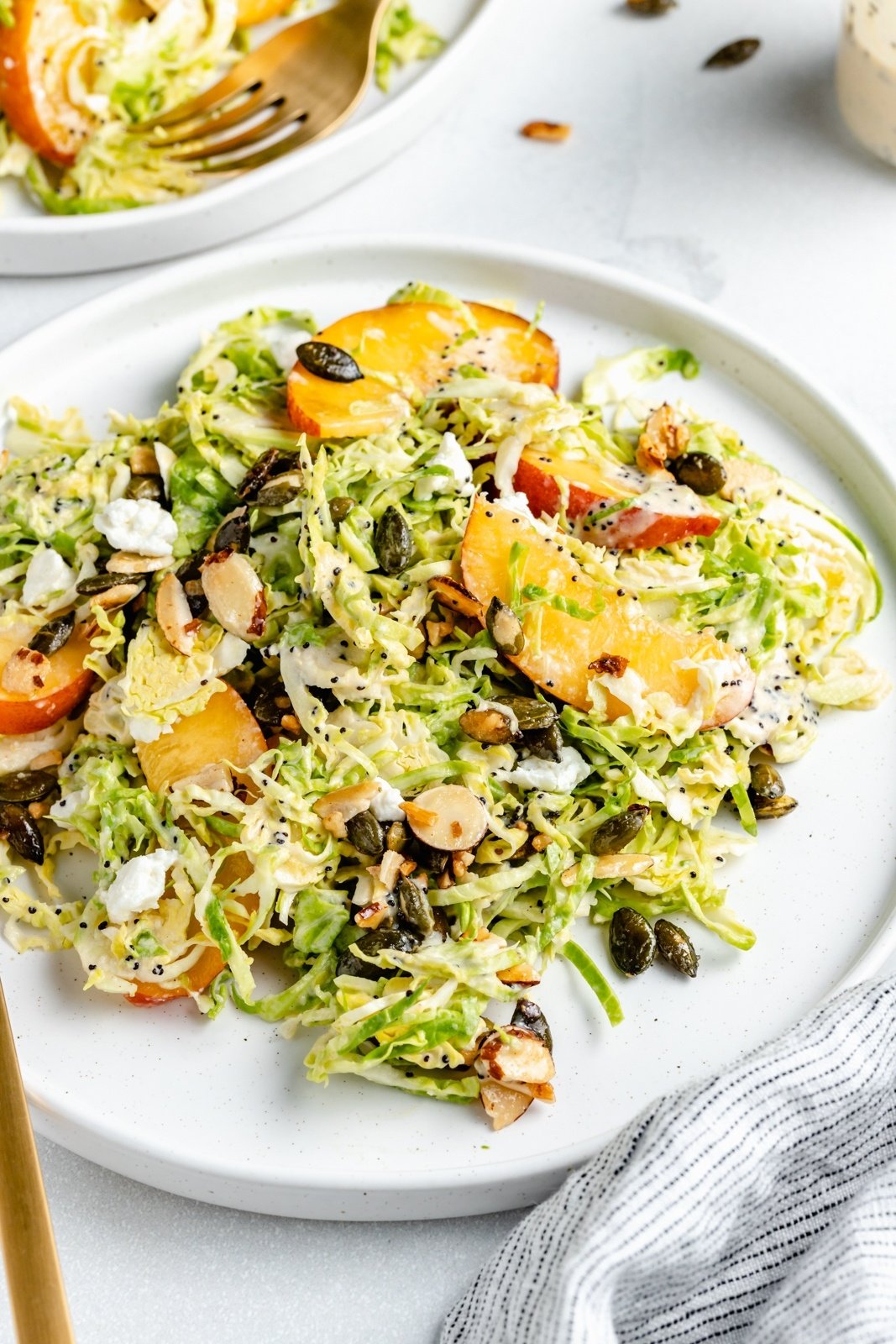 peach brussels sprouts salad on a plate