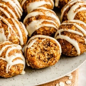 pumpkin energy bites on a plate with a bite taken out