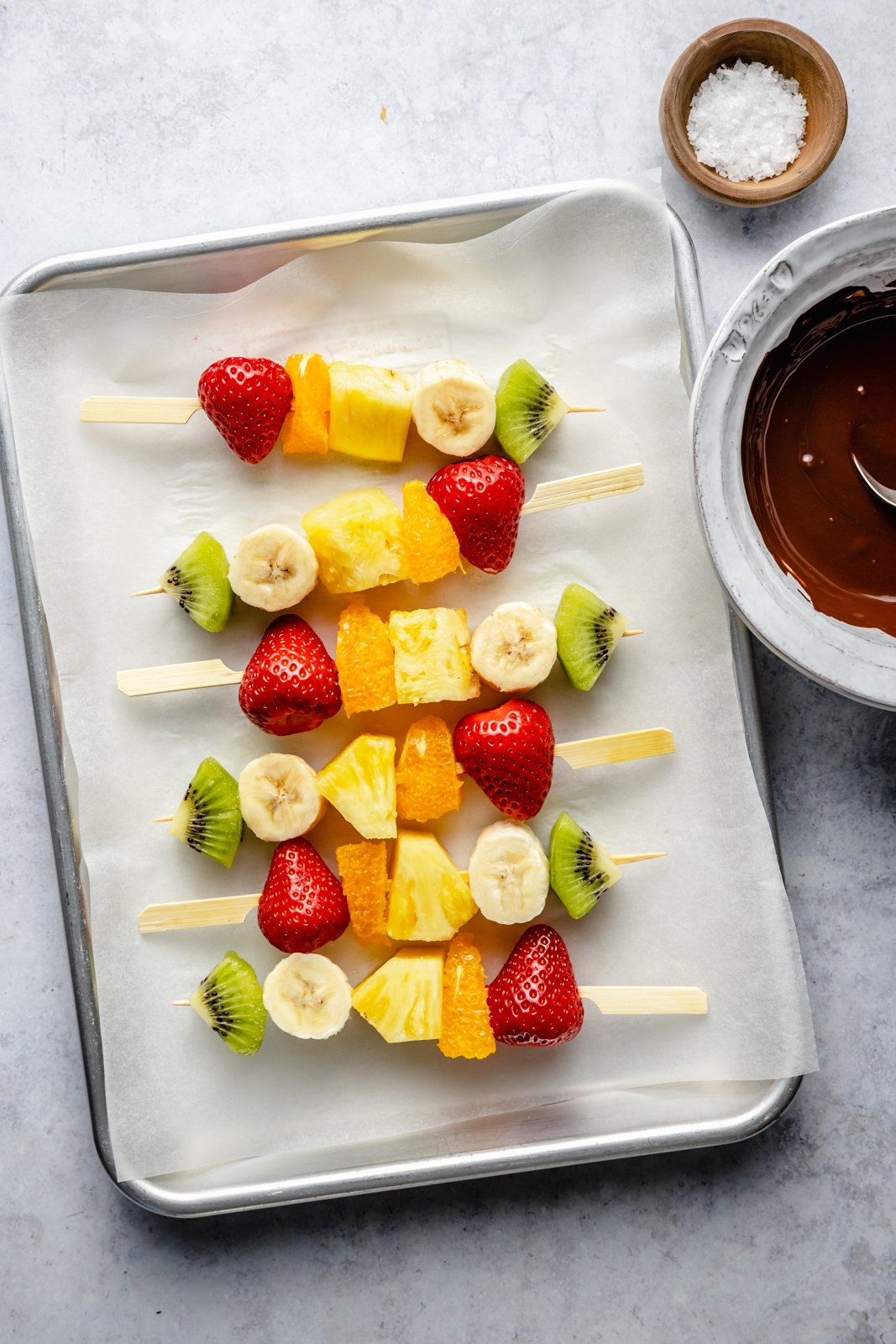 easy fruit skewers on a baking sheet