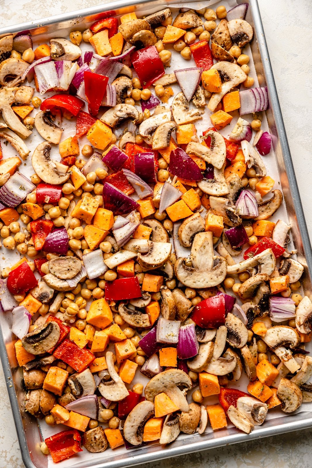 vegetables on a baking sheet ready to be roasted