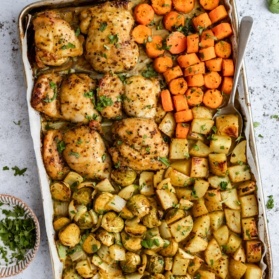 sheet pan honey mustard chicken and veggies on a pan