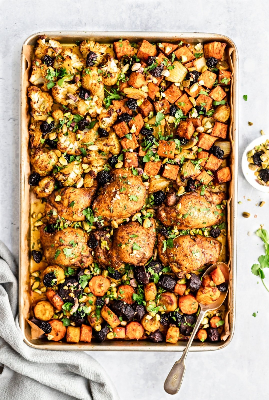 sheet pan Moroccan chicken and veggies on a pan