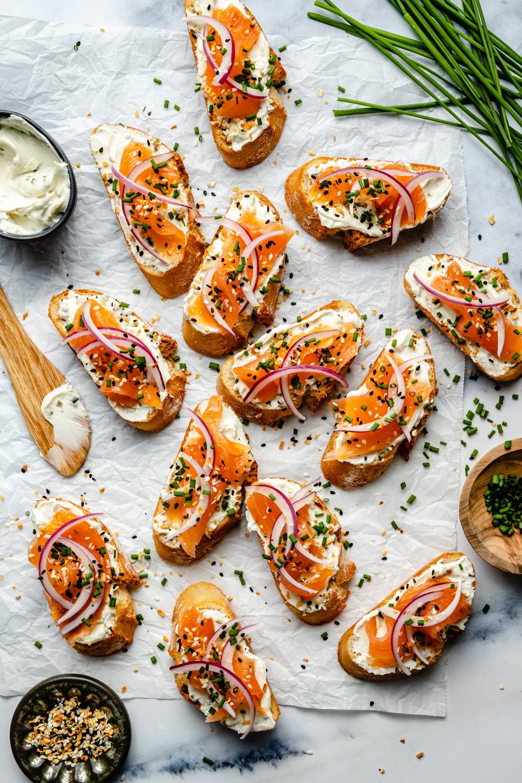 easy smoked salmon crostini on parchment paper