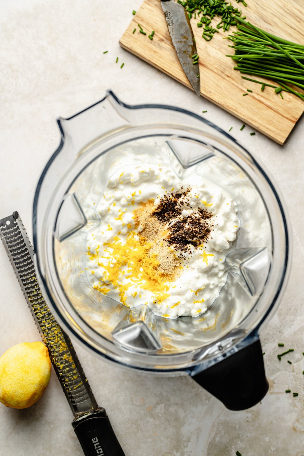 ingredients for high protein sour cream and onion dip in a blender