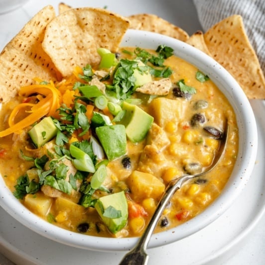healthy southwest corn chowder in a bowl with tortilla chips