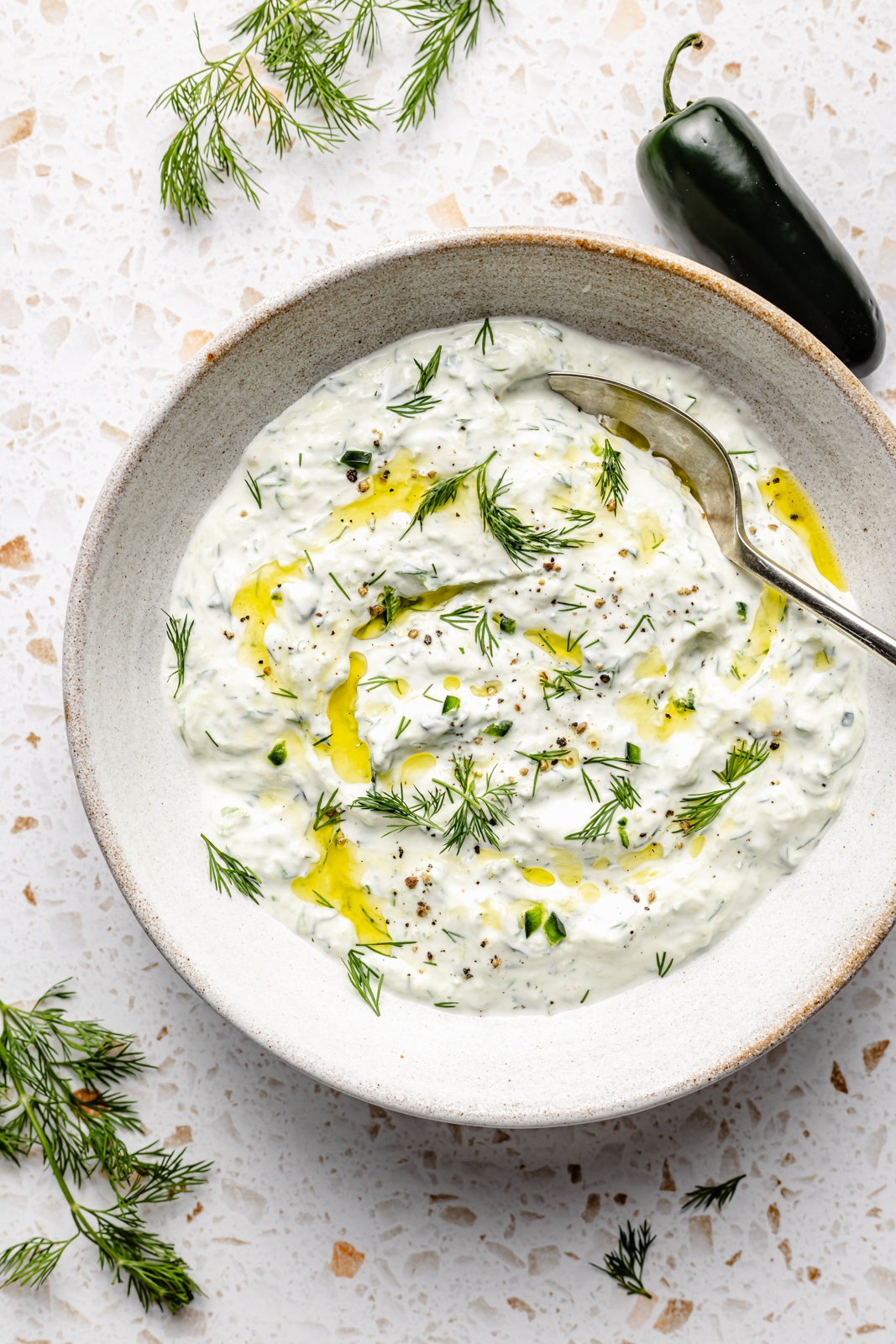 jalapeño tzatziki sauce in a bowl for chicken meatball pitas