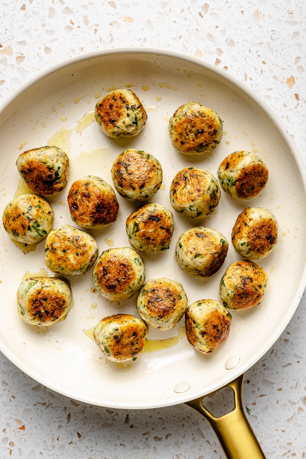 herby chicken meatballs in a pan