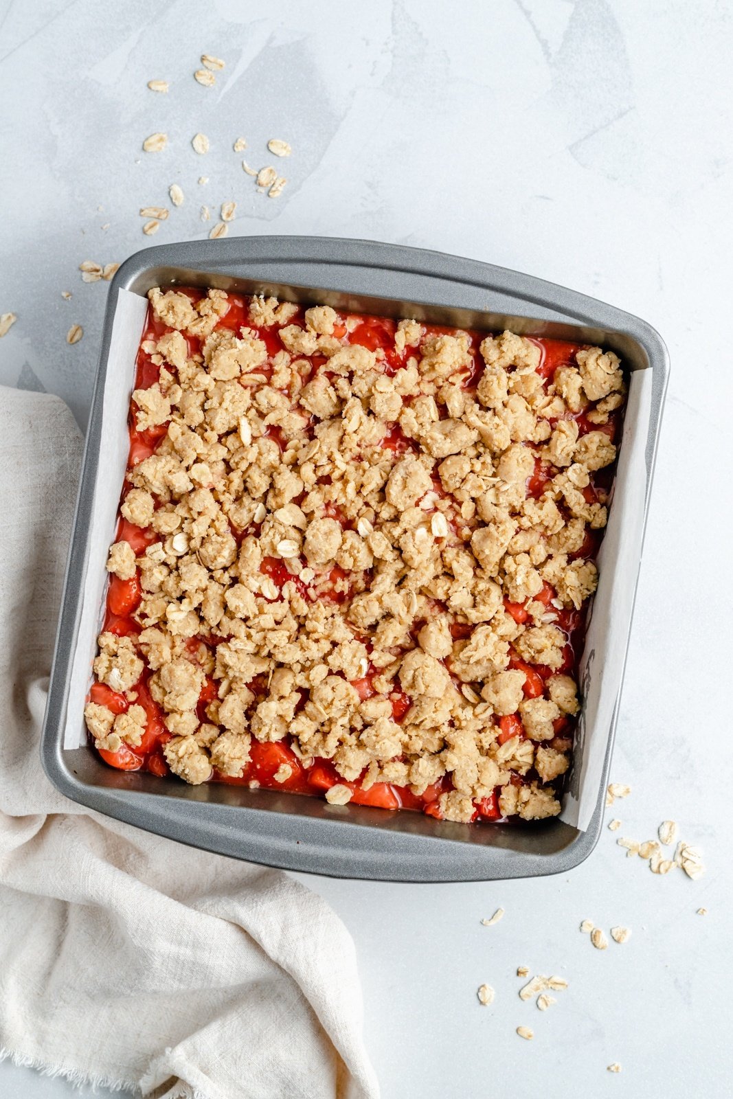 healthy strawberry crumble bars in a pan