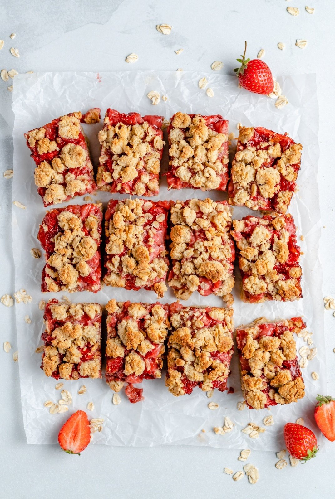 gluten free strawberry bars cut on parchment paper