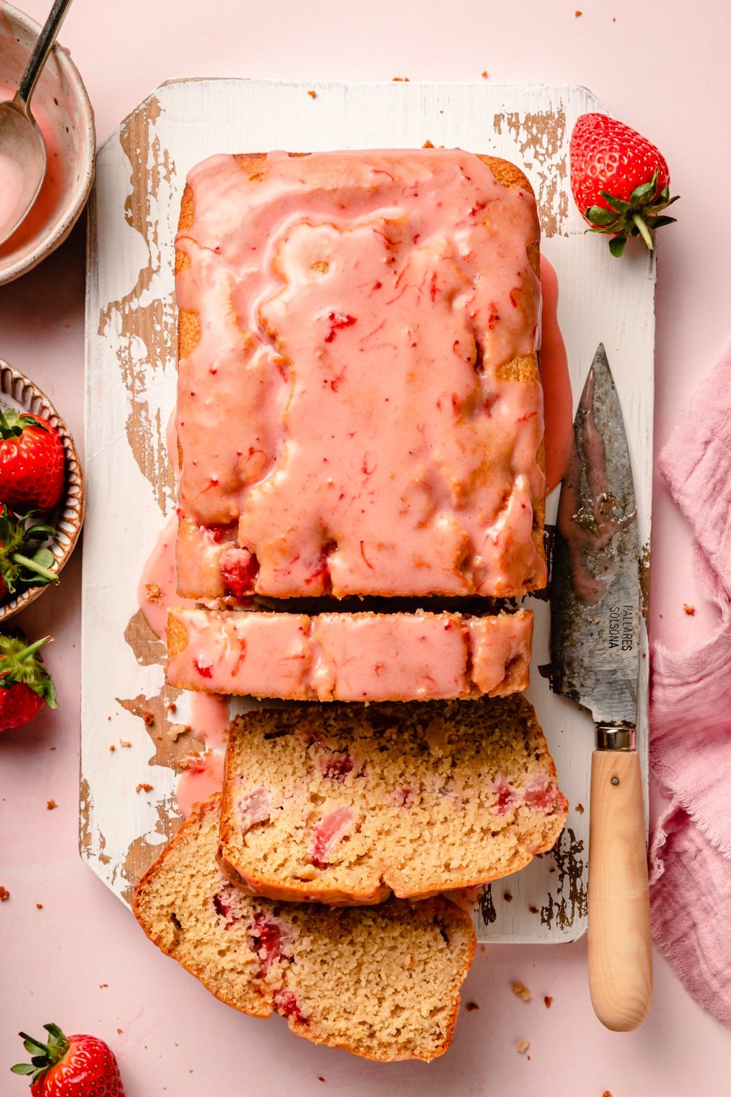 healthy strawberry bread sliced on a cutting board